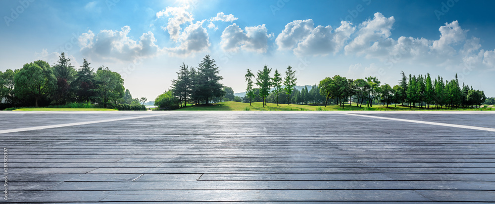 Empty wooden square and green woods natural scenery in city park