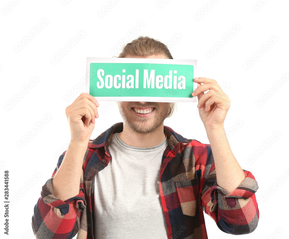 Male blogger holding paper with text SOCIAL MEDIA on white background