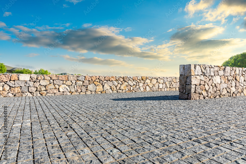 Empty stone floor and beautiful natural scenery in city park