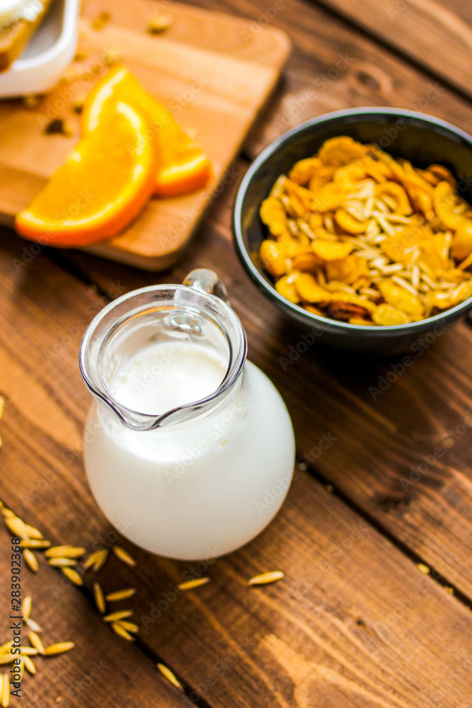 flakes for breakfast and jug of milk top view