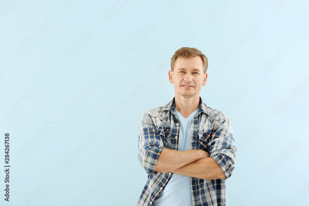 Portrait of handsome man on color background