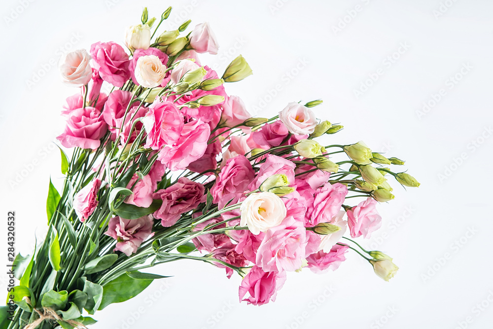 A bouquet of flowers eustoma on a white background