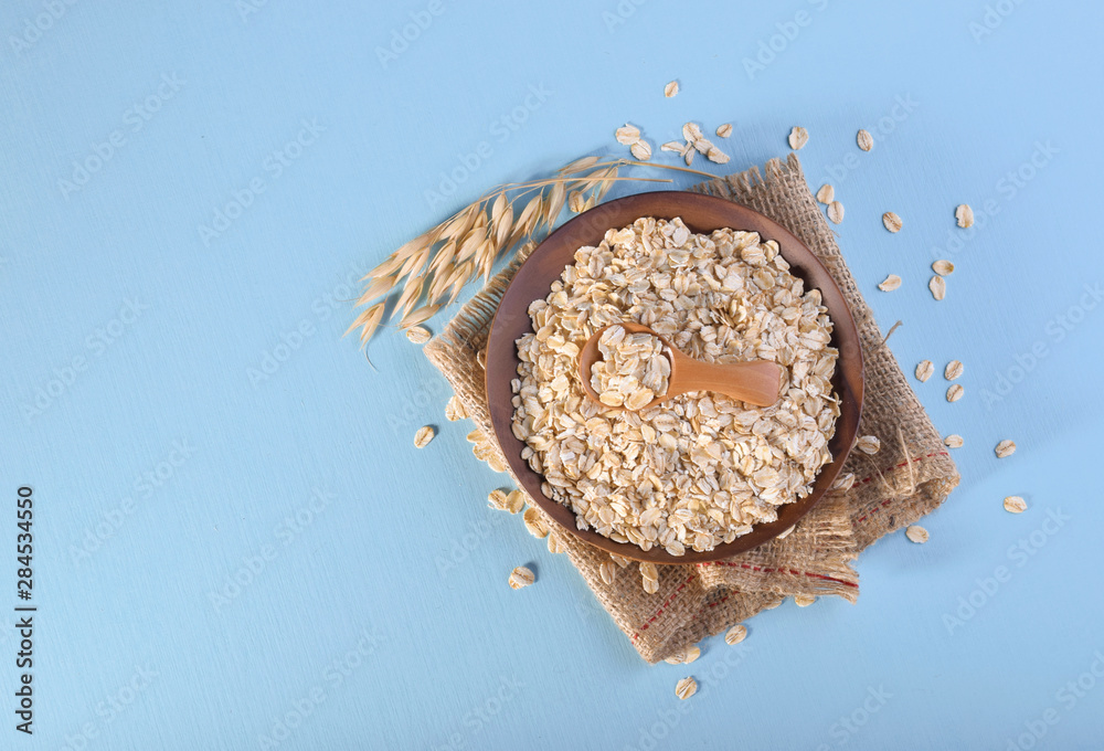 Rolled oats, healthy breakfast cereal oat flakes top view