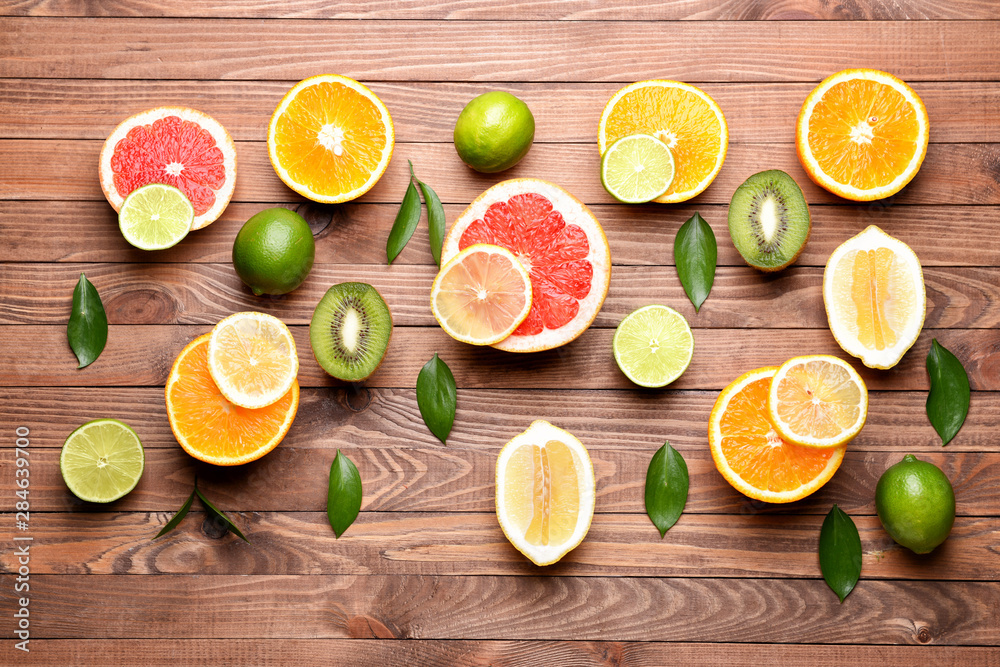 Different fresh fruits on wooden background