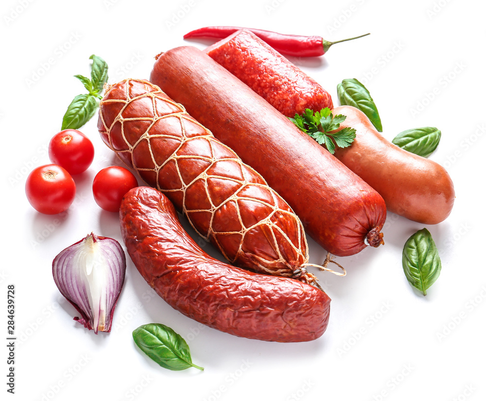 Assortment of sausages on white background