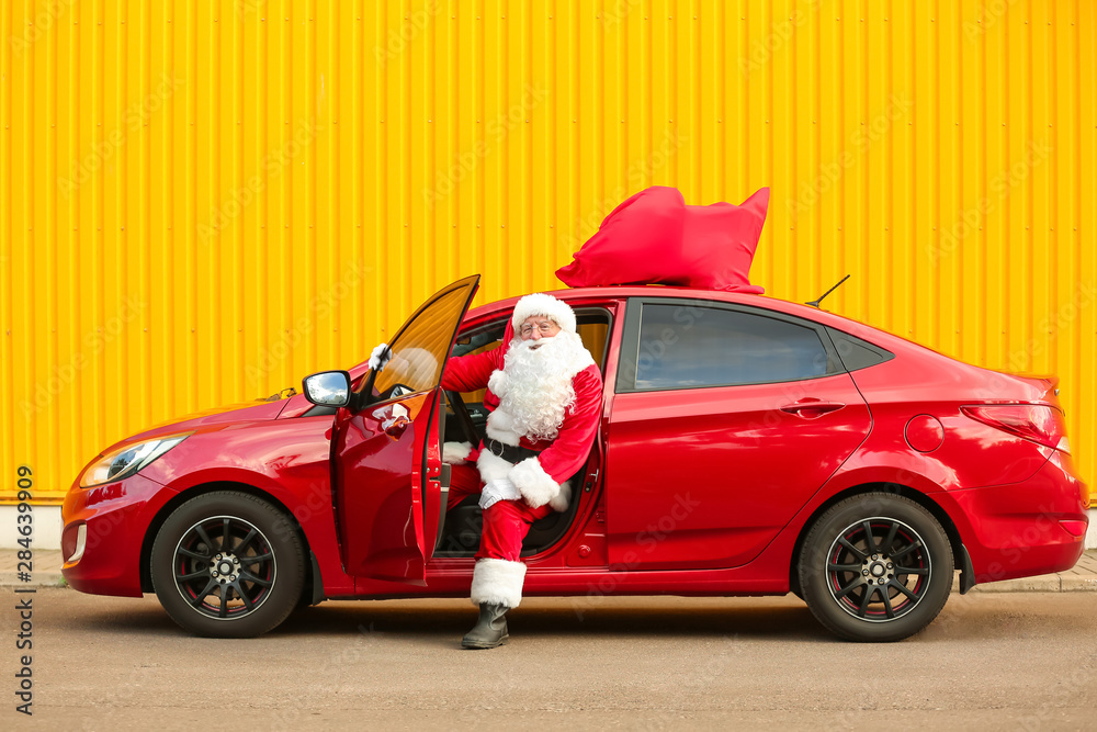 Santa Claus getting out of car outdoors