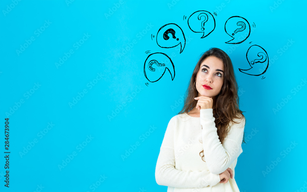 Question marks with speech bubbles with young woman in a thoughtful face