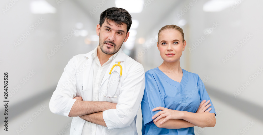 Doctors at hospital office working with another doctor. Healthcare and medical services.