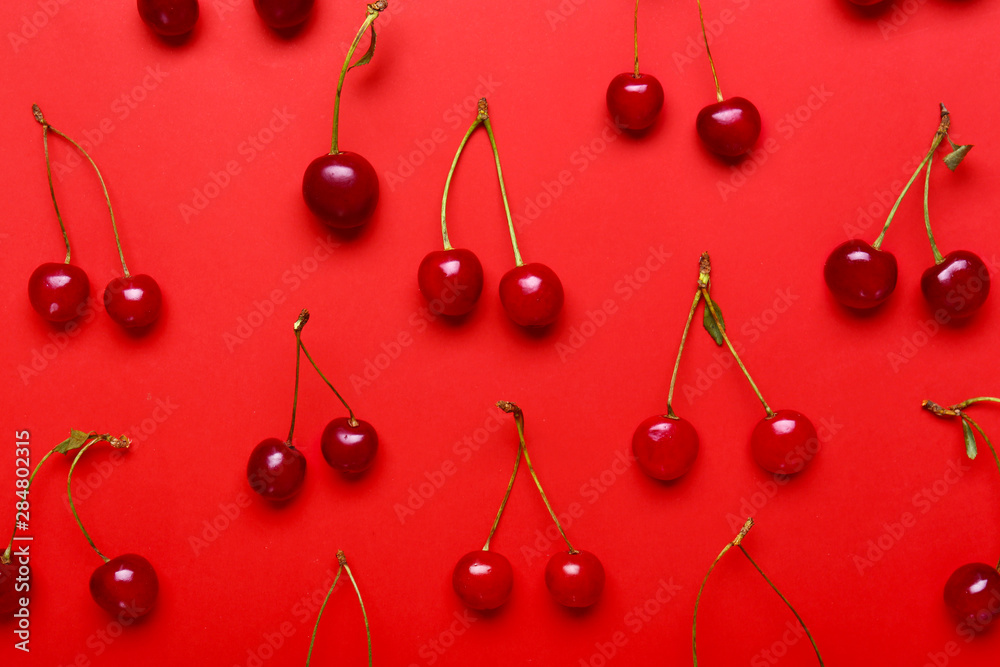 Many ripe sweet cherry on color background