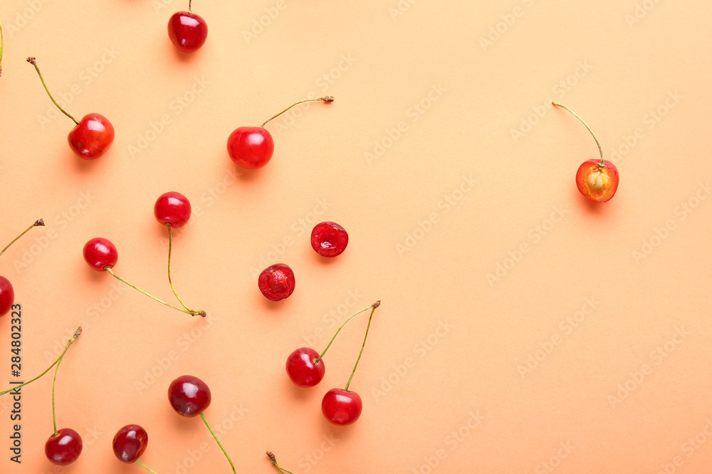 Cut cherry among whole ones on color background. Concept of uniqueness