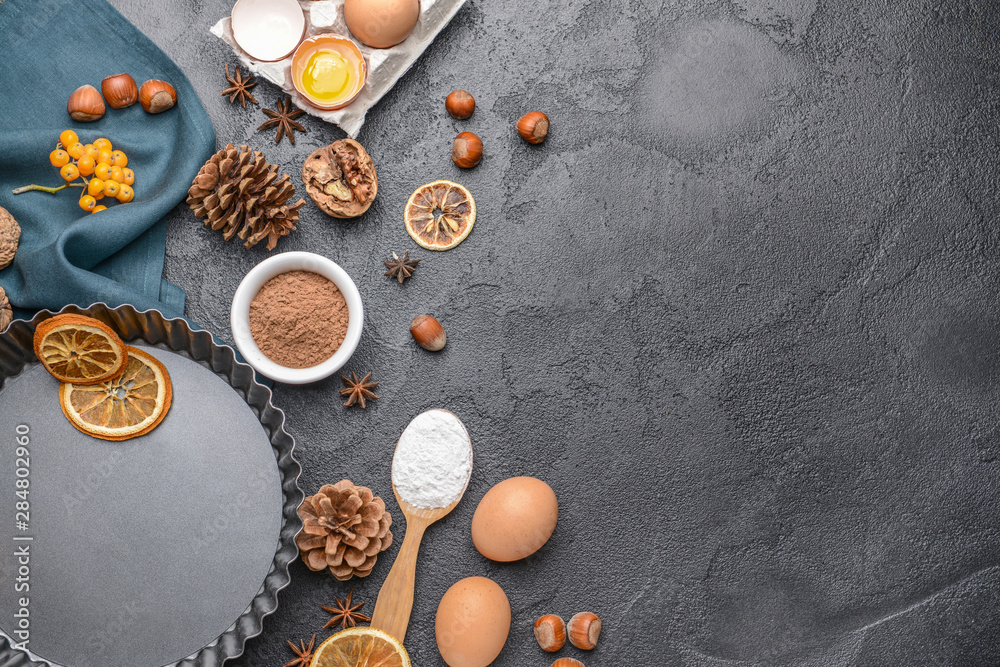 Ingredients for Christmas pie on dark background