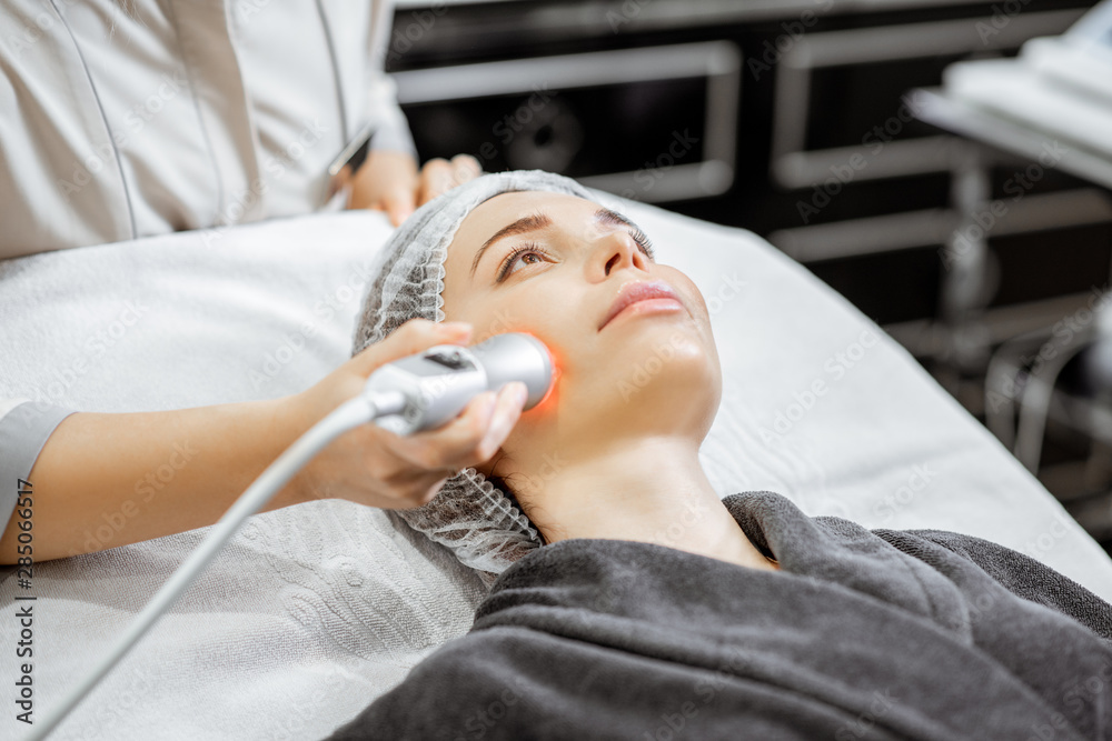 Woman during the oxygen mesotherapy procedure at the beauty salon, close-up view. Concept of a profe