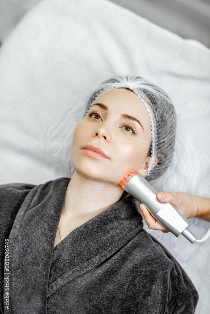 Woman during the oxygen mesotherapy procedure at the beauty salon, close-up view. Concept of a profe