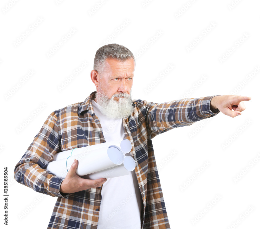 Mature male architect pointing at something on white background