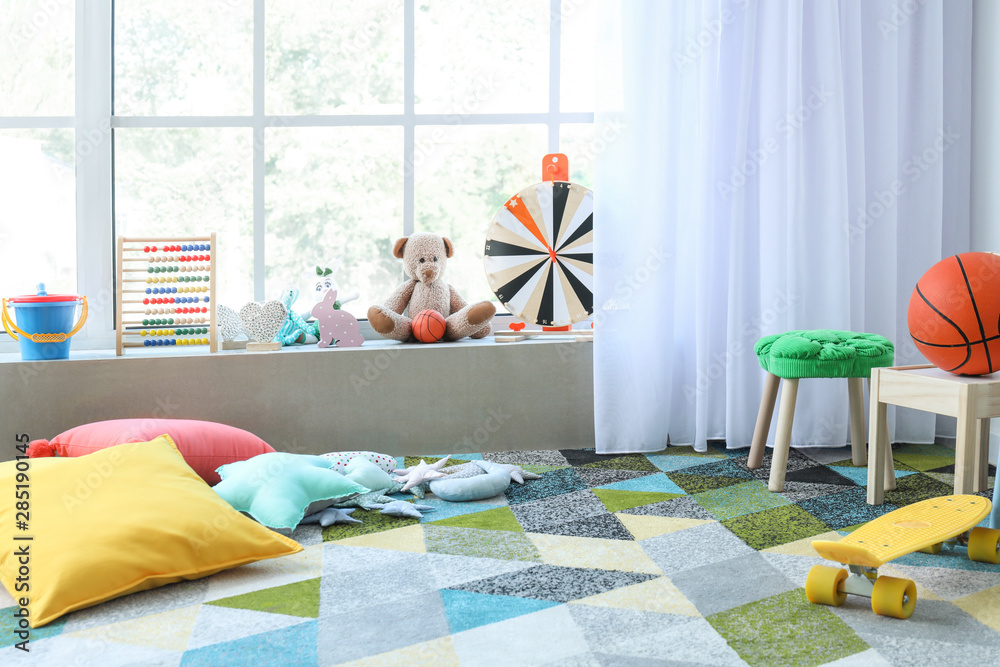 Interior of modern childrens room with toys