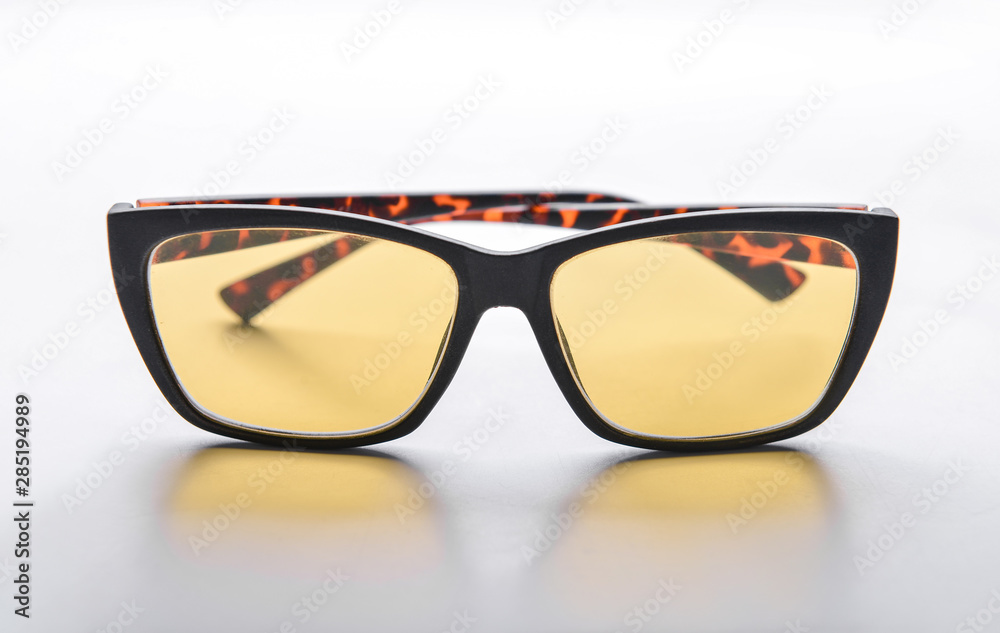 Stylish glasses on light background