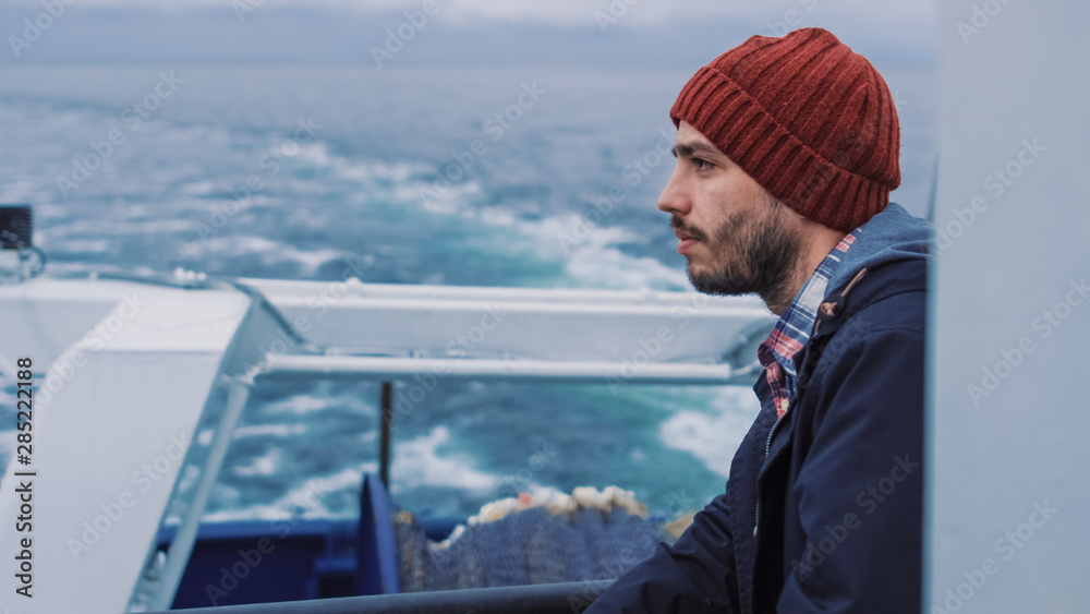 Shot of a Serios Sailor Stands on the Commercial Fishing Ship and Thoughtfully Looks At the Sea.