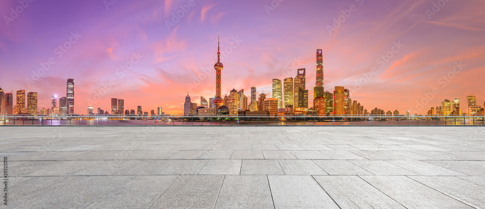 Shanghai skyline and modern buildings with empty square floor at sunrise,China.