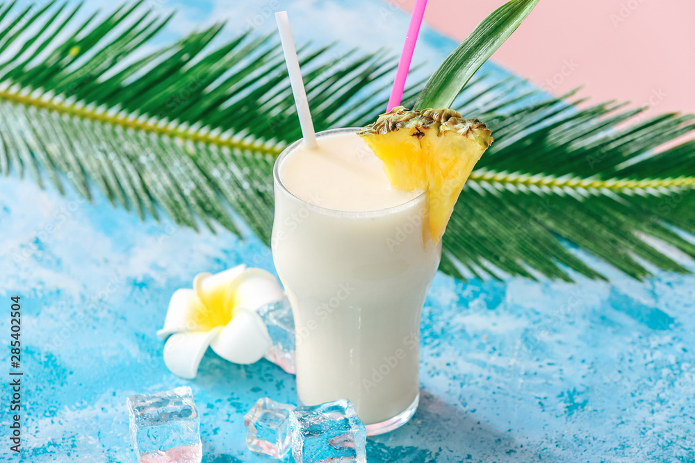 Glass of tasty Pina Colada cocktail on table