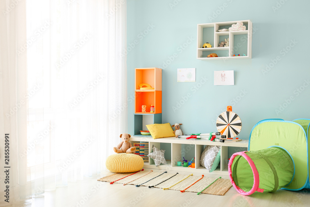 Interior of modern childrens room with toys