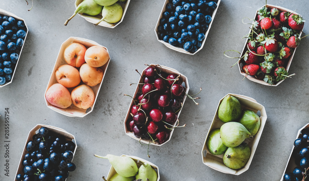 Summer fruit and berry assortment. Flat-lay of fresh strawberries, cherries, grapes, blueberries, pe