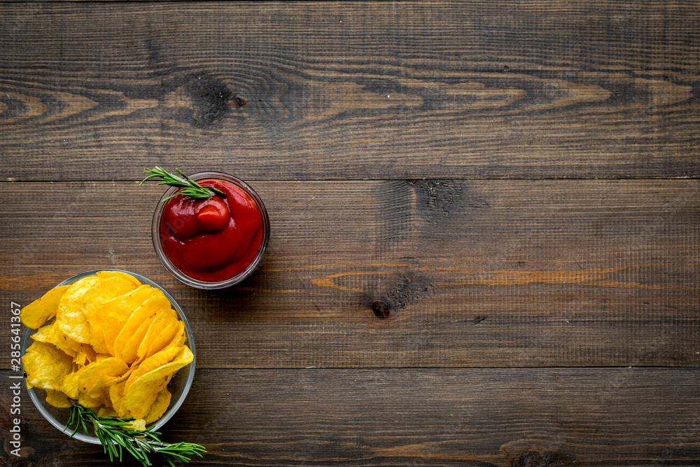 Potato crisps with tomato sauce on wooden background top view mockup