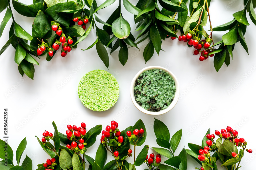 organic cosmetic with herbs and berries on white background top view