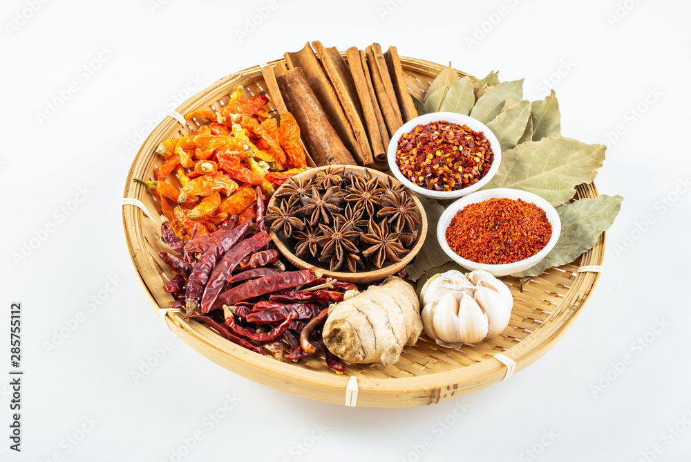 A plate of Chinese food commonly used spicy cooking seasoning spices on a white background