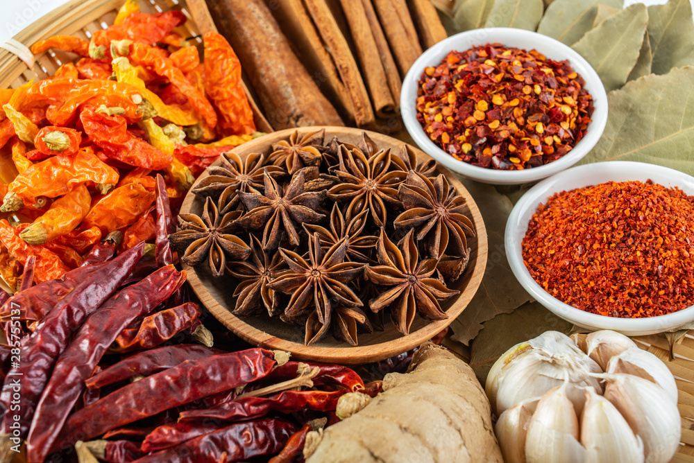 A plate of Chinese food commonly used spicy cooking seasoning spices on a white background