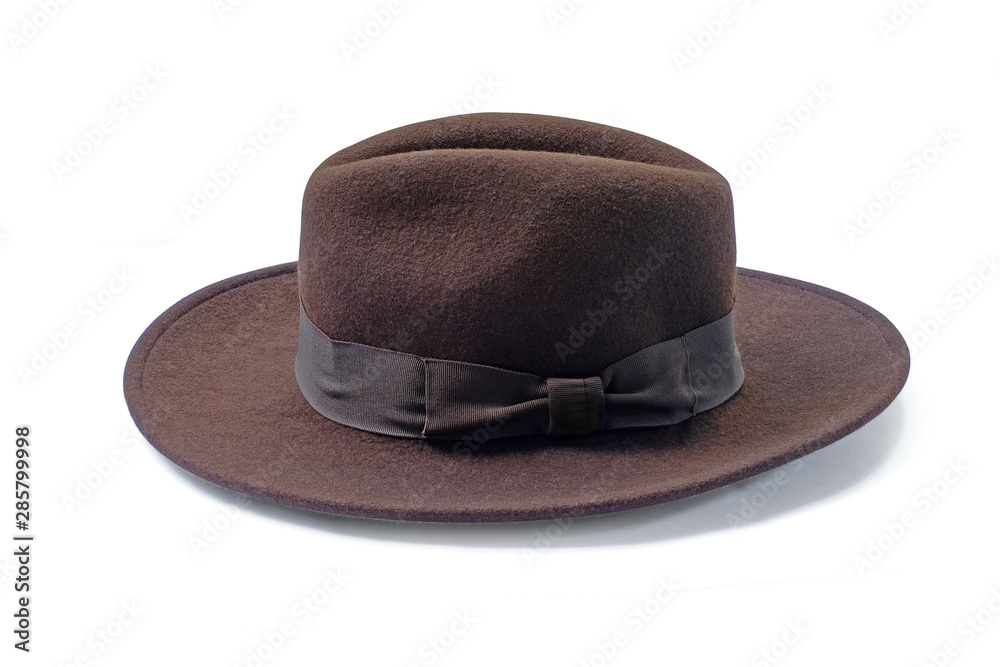 Vintage brown hat fasion with white ribbon isolated on white background. This has clipping path