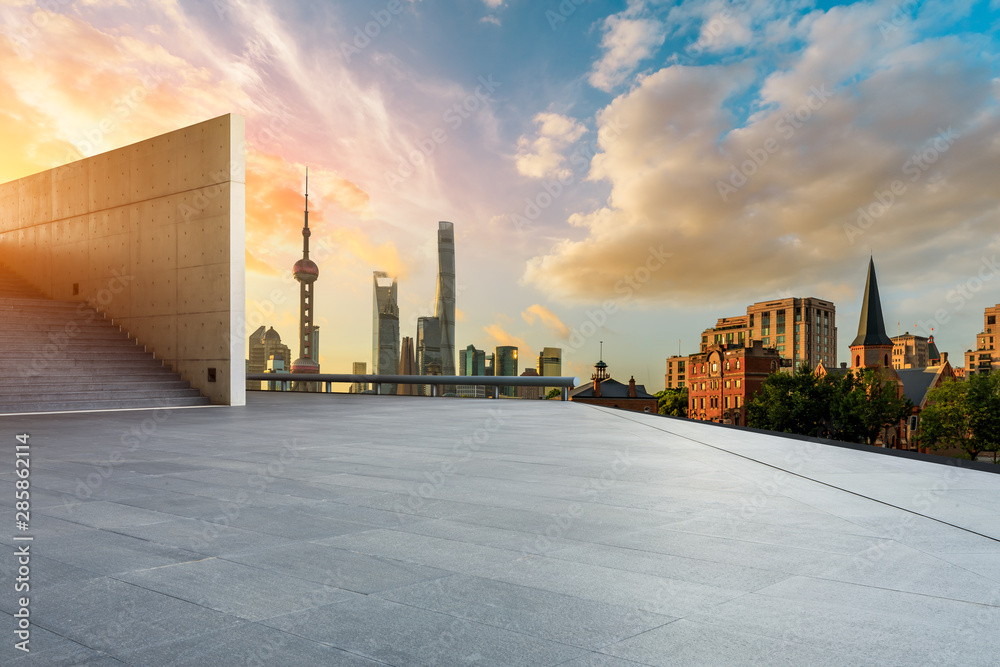 Empty square floor and modern city scenery at sunrise in Shanghai,China.