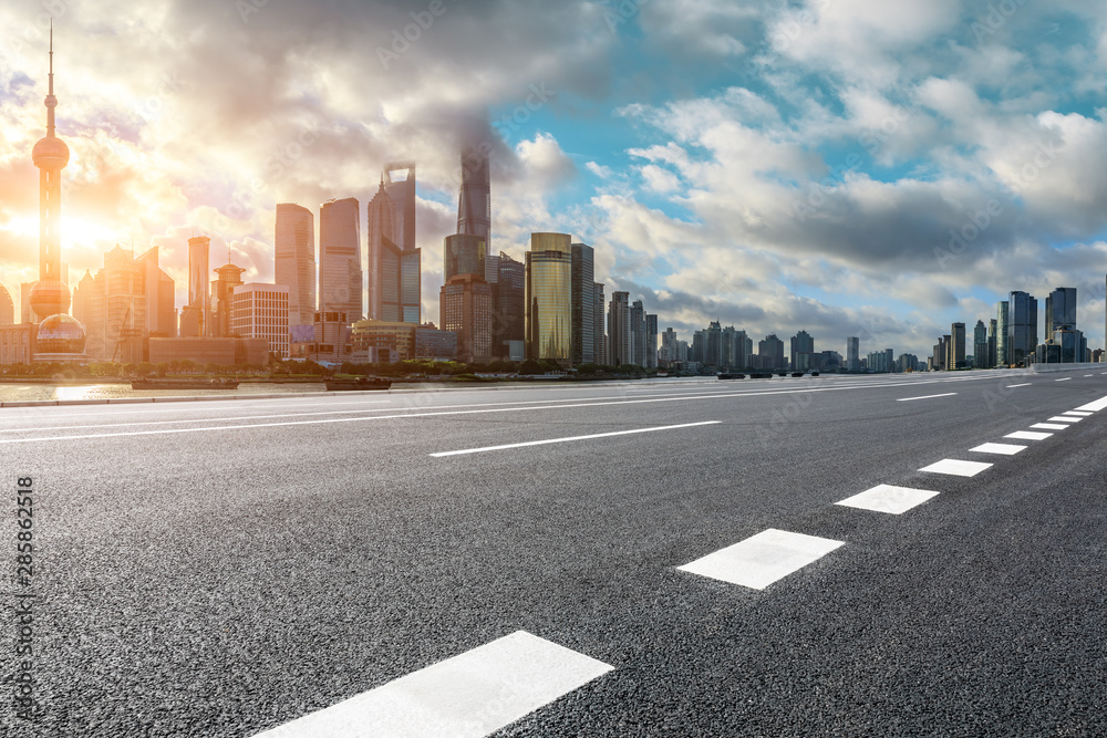 Empty highway and beautiful city buildings scenery at sunrise in Shanghai,China.