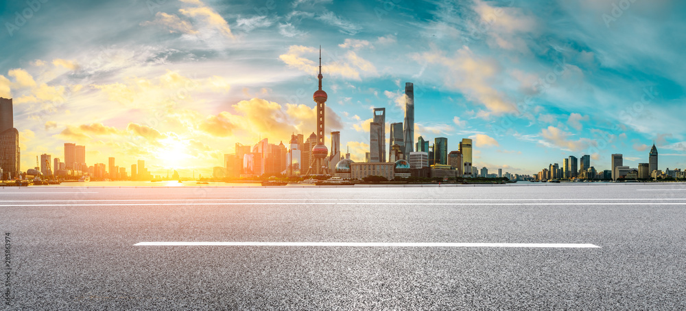 Empty highway and beautiful city buildings scenery at sunrise in Shanghai,China.