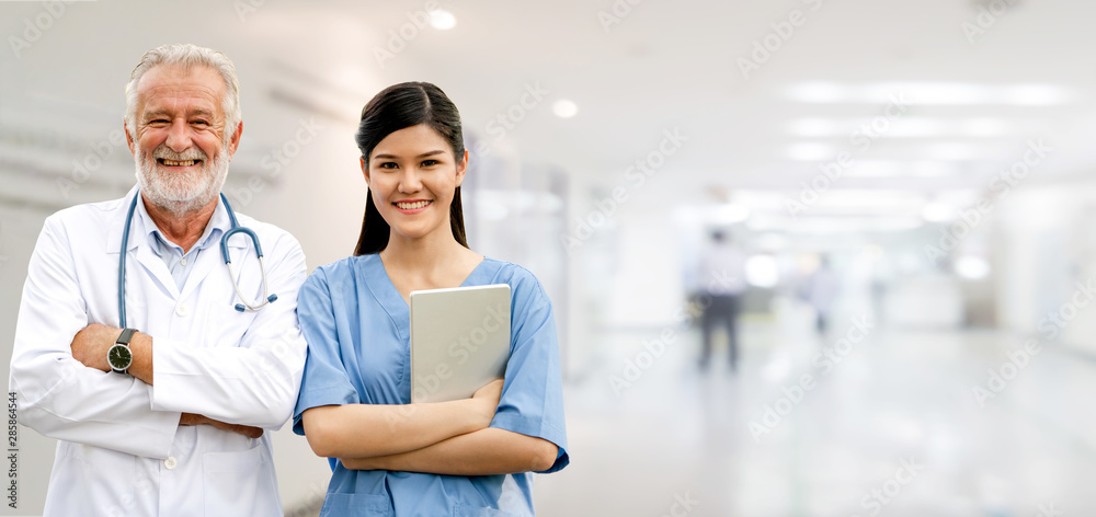 Senior doctor working with young doctor in the hospital. Medical healthcare staff and doctor service