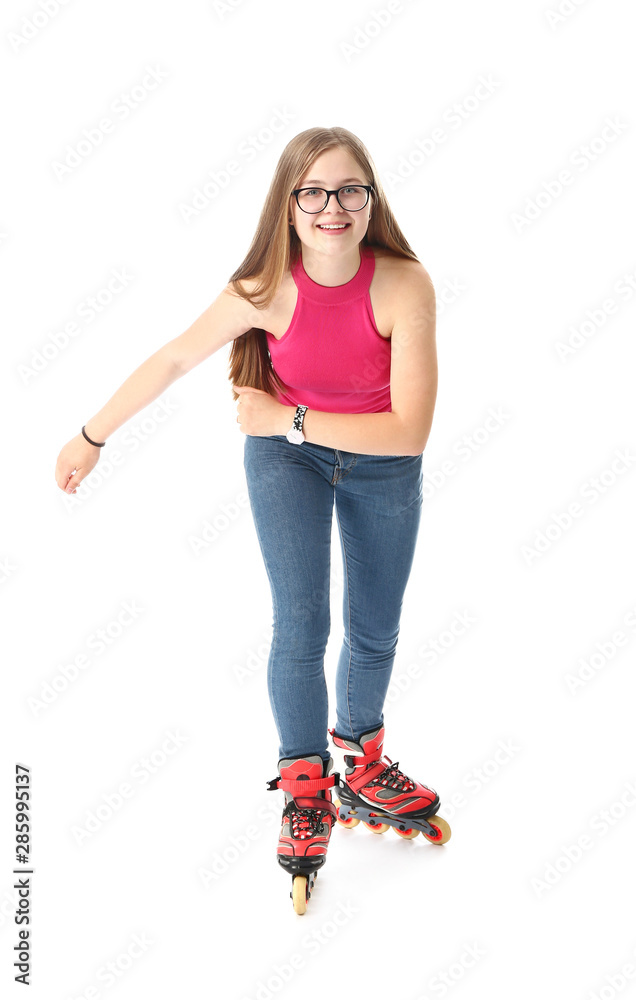 Teenage girl on roller skates against white background