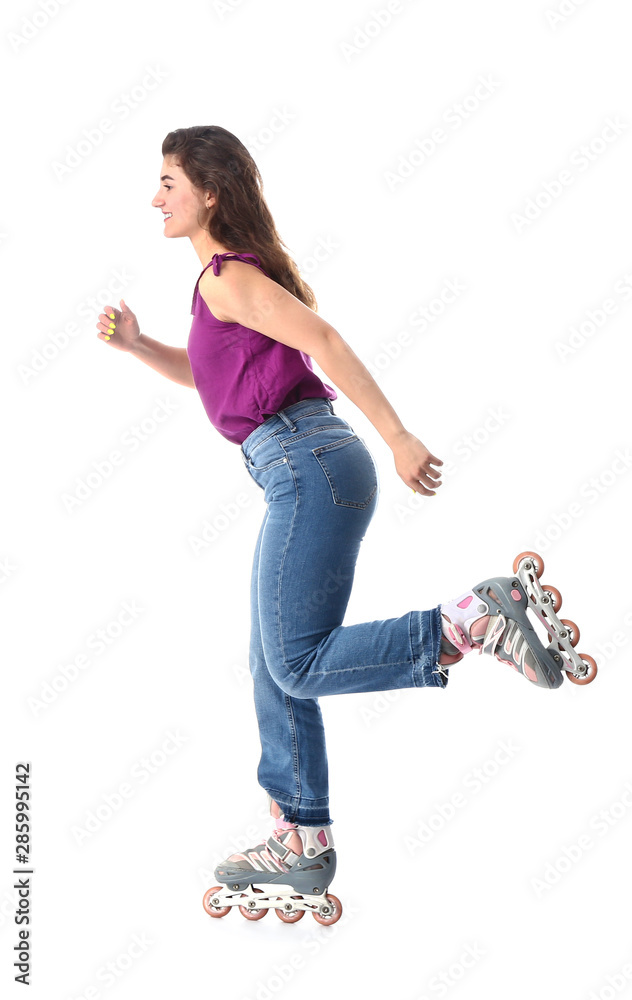 Teenage girl on roller skates against white background