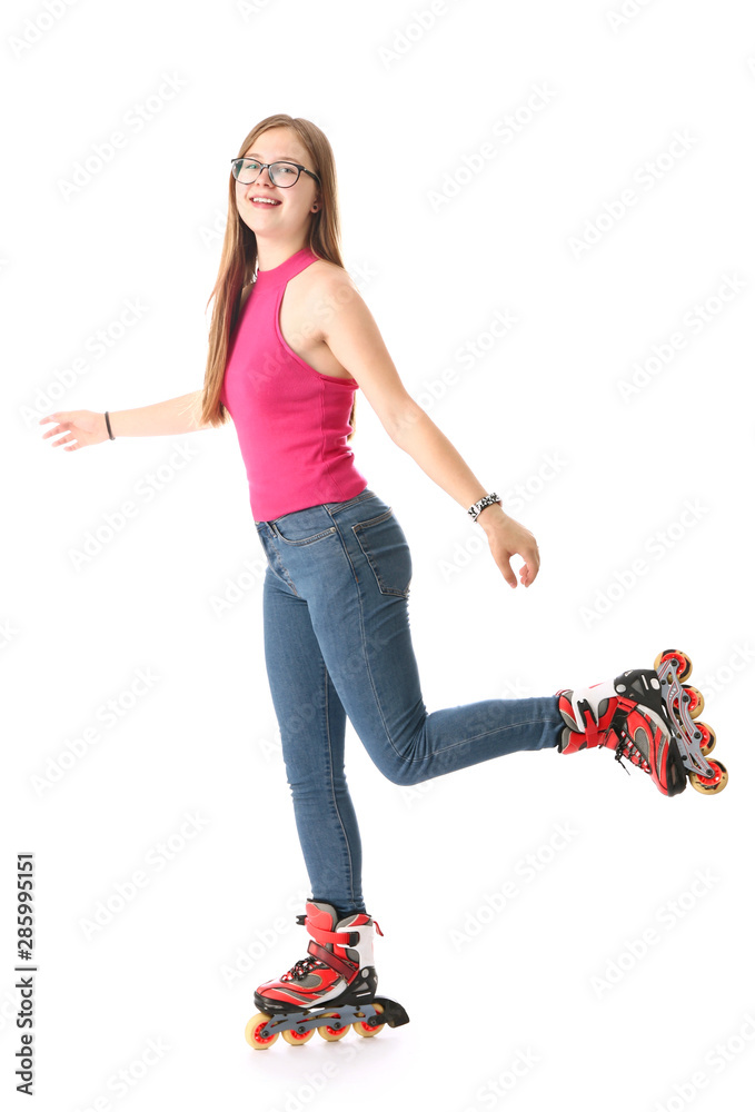 Teenage girl on roller skates against white background