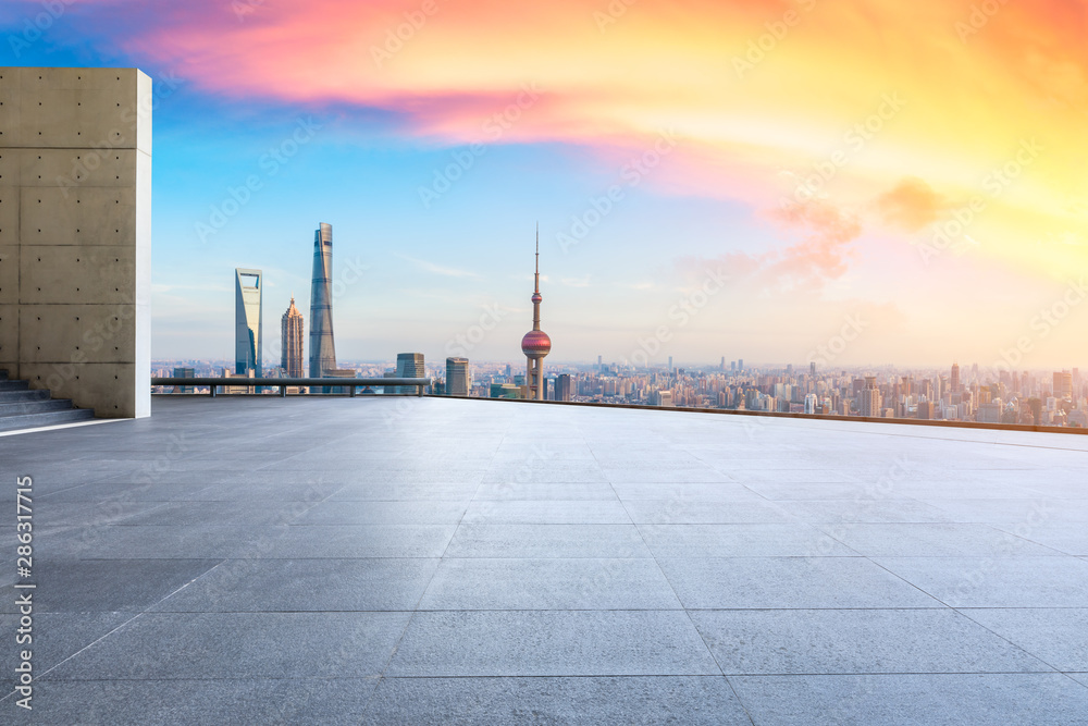 Empty square floor and city skyline with buildings at sunset in Shanghai,China.