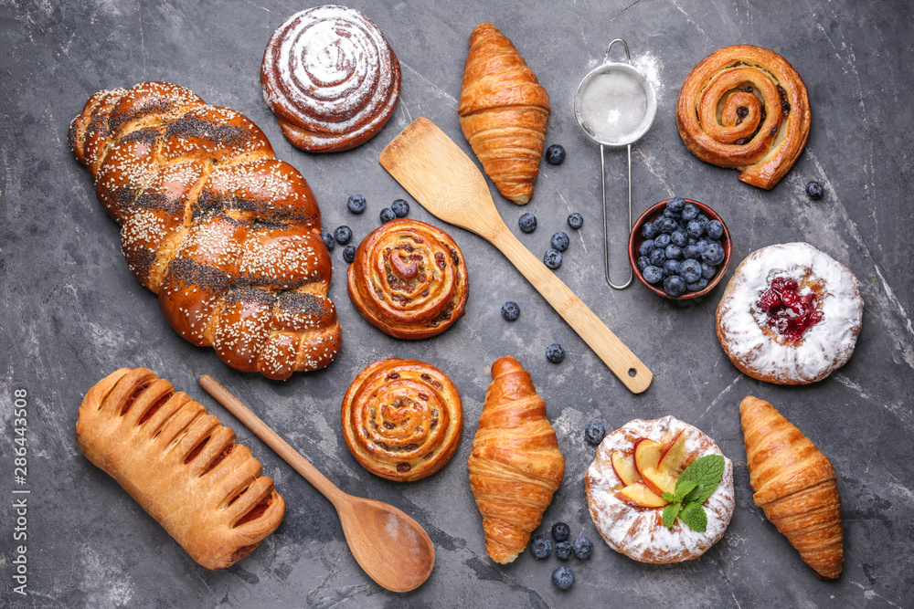 Assortment of sweet pastry on grey background