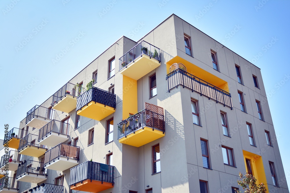 Modern apartment buildings on a sunny day with a blue sky. Facade of a modern apartment building