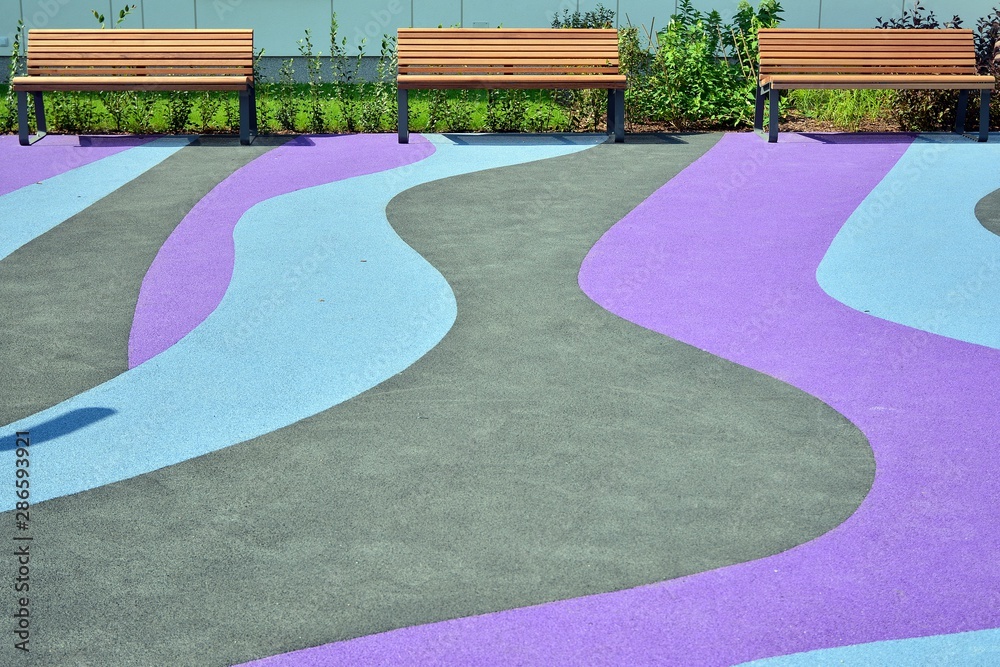 Playground rubber flooring. Colorful landscape.