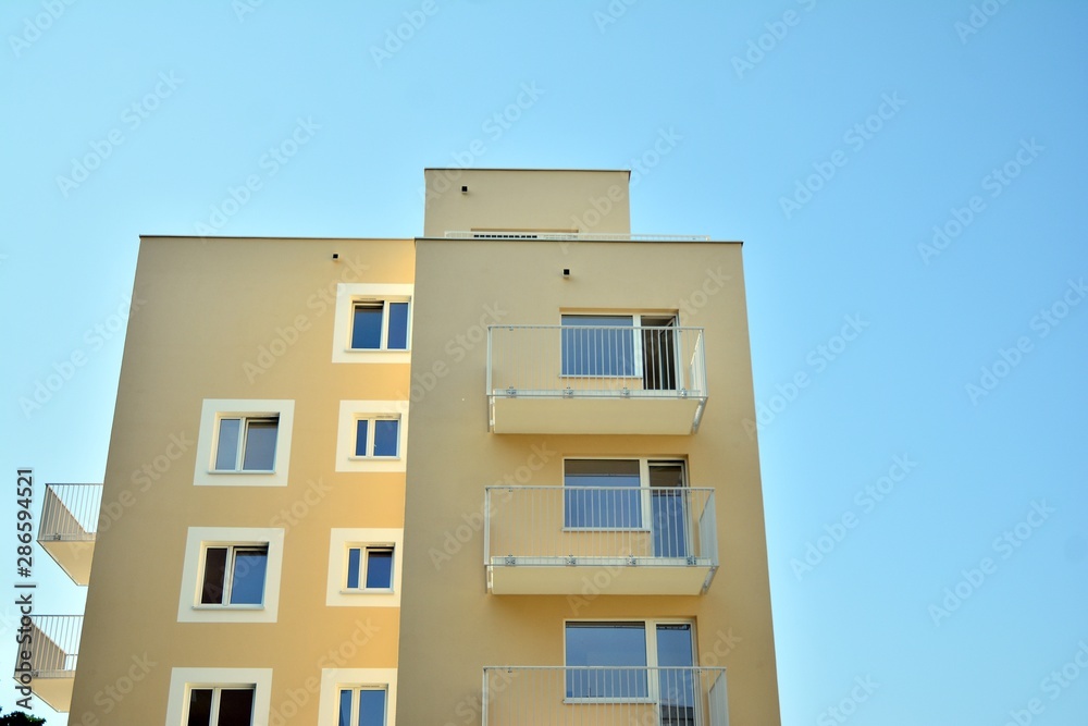 Modern apartment buildings on a sunny day with a blue sky. Facade of a modern apartment building