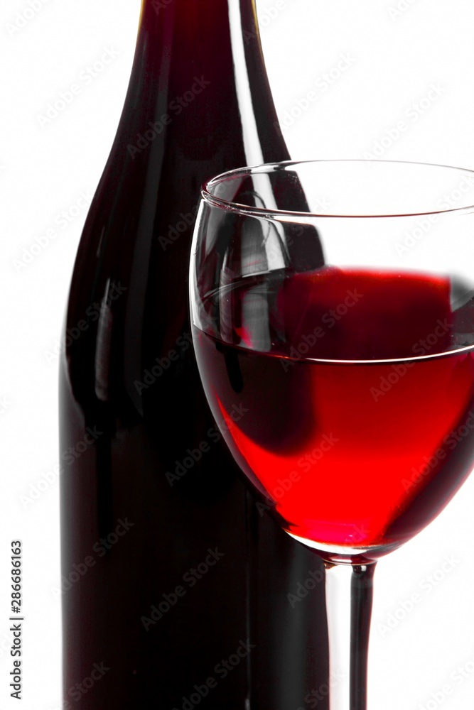 Glass Of Wine With Wine Bottle Close-up