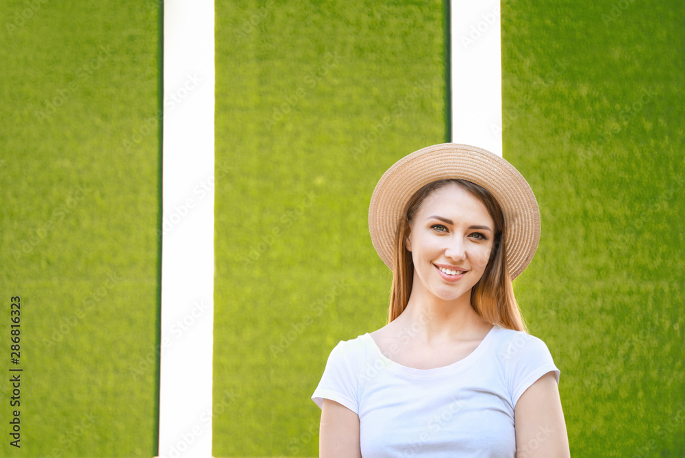 Woman in stylish t-shirt on color background