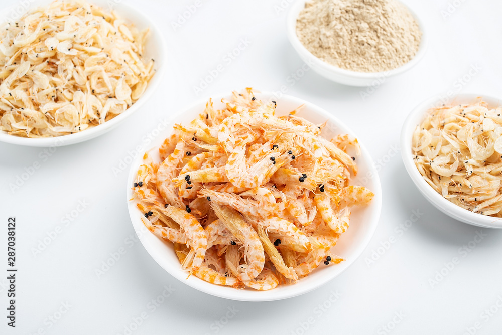 Dried seafood white shrimp and shrimp skin powder on white background