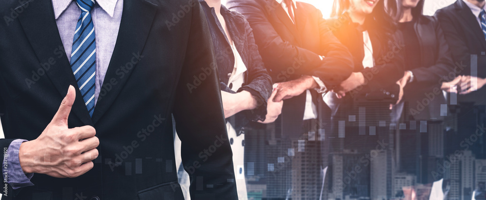 Business people group standing together with city office building background double exposure. Modern