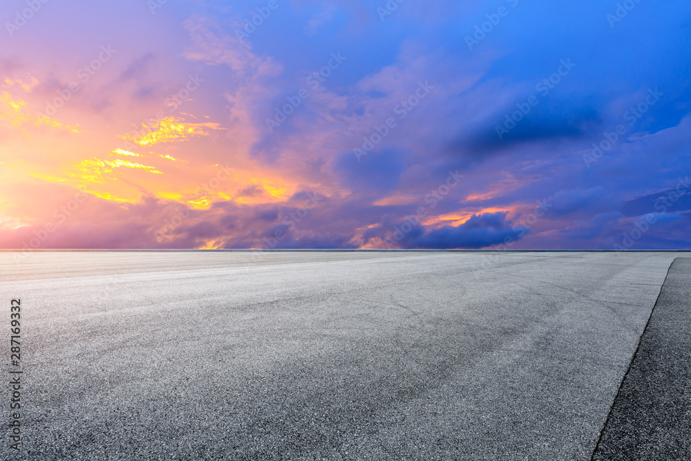 Empty race track road and beautiful sky clouds at sunset