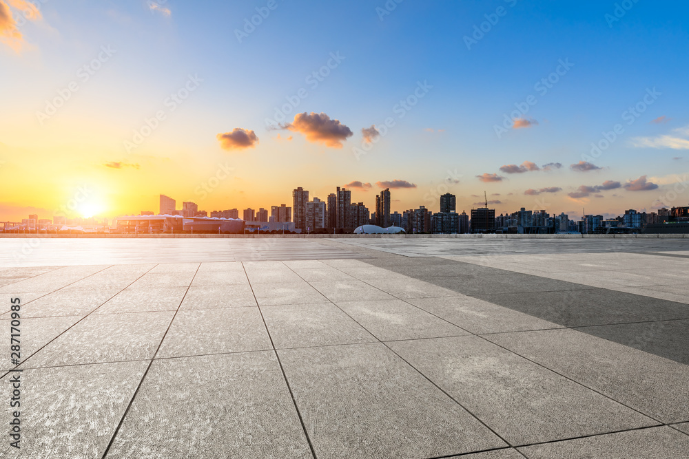 Empty square floor and city skyline at sunset in Shanghai