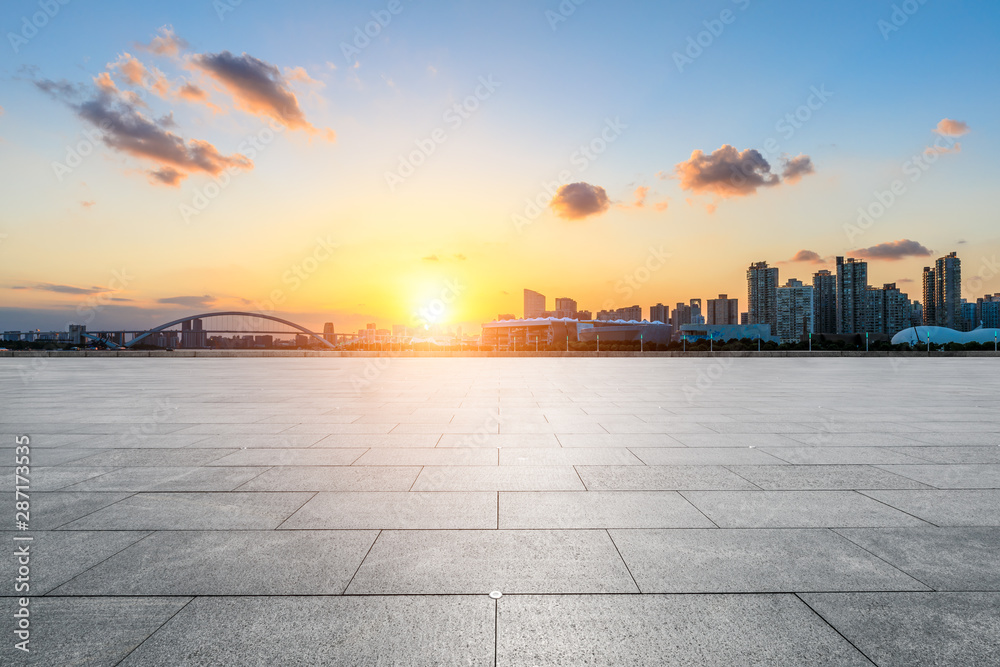 Empty square floor and city skyline at sunset in Shanghai