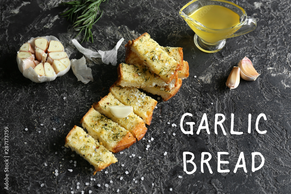 Composition with tasty cut garlic bread on table